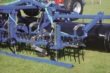 Mole hill board
A mole hill board can be mounted in front of the harrow. Depth is controlled by spindles. It is possible to adjust the aggressiveness of the springtines. This is easily done by displacing pins and pulling handles.