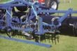 Mole hill board
A mole hill board can be mounted in front of the harrow. Depth is controlled by spindles. It is possible to adjust the aggressiveness of the springtines. This is easily done by displacing pins and pulling handles.